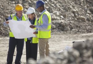 Construction workers inspecting plans for BESS