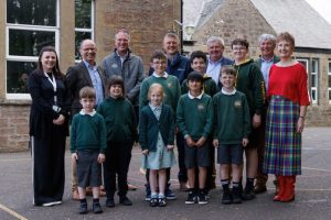 The project team and children in the playground at Blackford Primary School