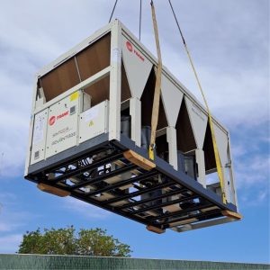 Trane heat pump being lowered into position